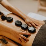 A soothing hot stone massage therapy session for relaxation and wellness.